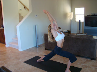 Woman doing Virabatrasana A yoga pose