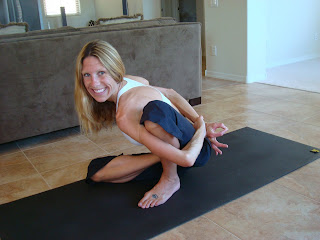 Women doing Marichyasana D yoga pose