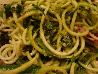 Homemade pest tossed with zucchini noodles