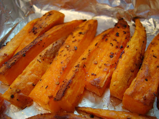 Close up of Roasted Sweet Potatoes on foil lined pan