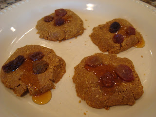 Vegan Maple & Flax "Peanut Butter" Pancake-Cookies on plate topped with raisins and maple syrup