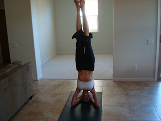 Woman doing the sirsasana yoga pose