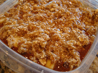 Finished Apple Crumble in clear container showing crumble topping