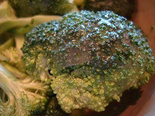 Broccoli with dressing on it