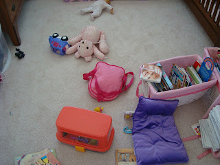 Childs bedroom showing messy items across floor
