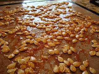 Spread out squash seeds on dehydrator tray