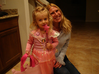 Young girl in fairy princess costume with woman kneeling behind her