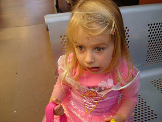Young girl in fairy princess costume on bench tired