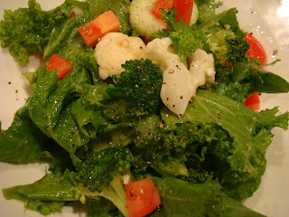 Kale salad with vegetables and homemade slaw dressing in bowl