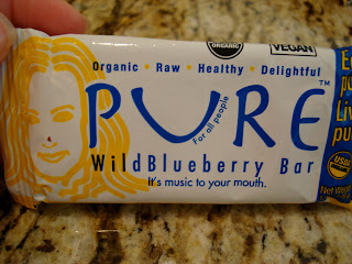 Hand Holding Wild Blueberry Pure Bar