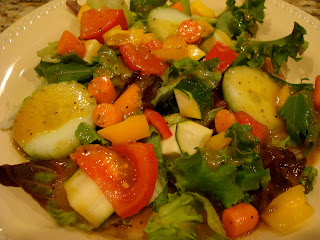 Mixed Greens Salad with Vegetables topped with Holiday-Spice Orange Vinaigrette