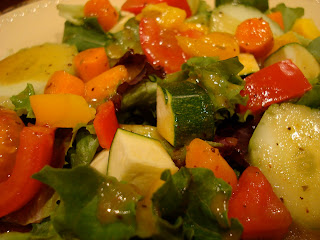 Close up of Salad topped with Holiday-Spice Orange Vinaigrette