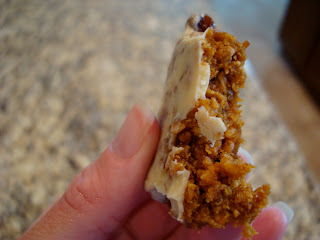 Hand holding portion of Clif Bar