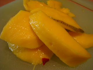 Sliced mango on plate 
