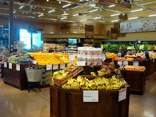 Inside grocery store in produce section