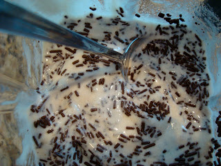 Close up of spoon stirring in sprinkles