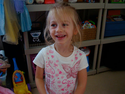 Young girl standing and smiling