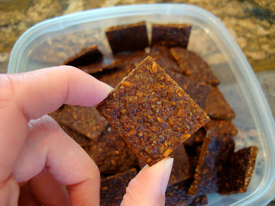 Cracker being held over clear container