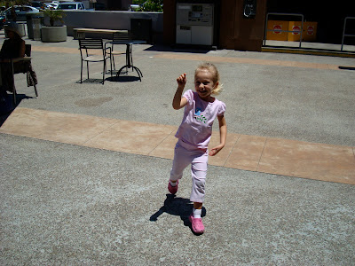 Young girl outside pointing