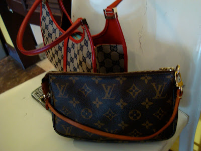 Louis Vuitton bags with red accents