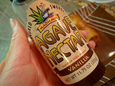 Hand holding bottle of Vanilla Agave