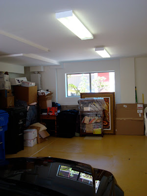 Widow view in garage full of storage items