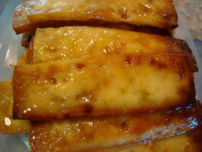 Stacked Green Tea and Honey Ginger Baked Tofu in clear container