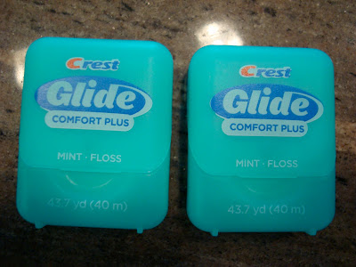 Two containers of floss