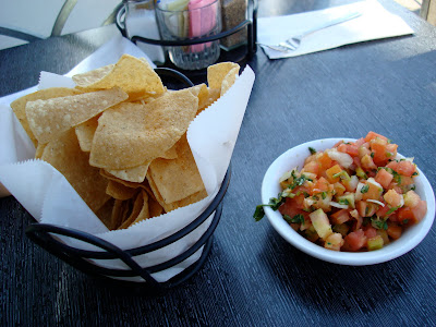 Chips and salsa on table