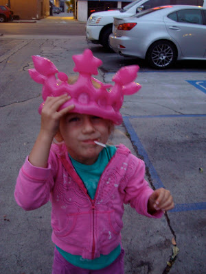 Young girl wearing a blow up pink crown