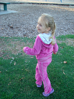 Backside of young girl running
