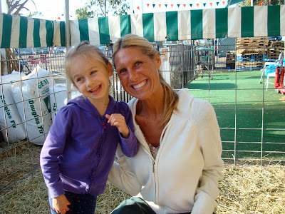 Young girl and woman smiling at Pumpkin Patch