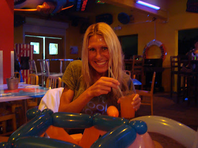 Woman holding cocktail in bar