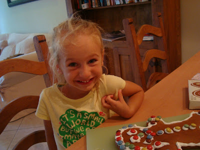 Young girl sitting in front of decorated Gingerbread Man