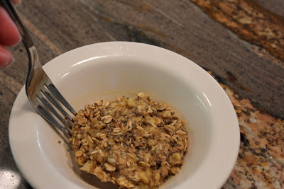 Microwave Banana Oat Cakes in white bowl with fork