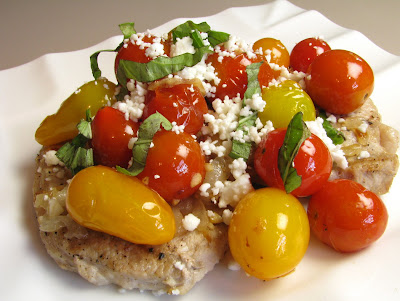 pork chops with tomatoes, caramelized onions and feta cheese