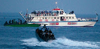 Israeli forces approach one of six ships bound for Gaza in the Mediterranean Sea on May 31, 2010