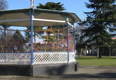 Leamington bandstand with colourful string strung between the posts