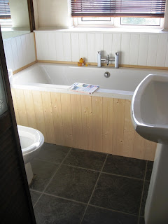 View of bathroom with slate tiled floor