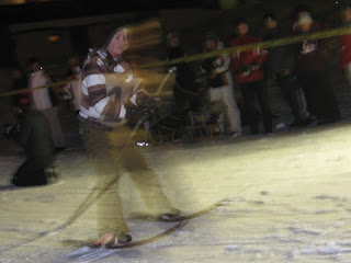 Blurry young person with curved sticks tied to his feet