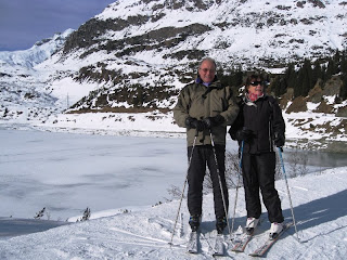 J&C on skis with frozen lake in the background