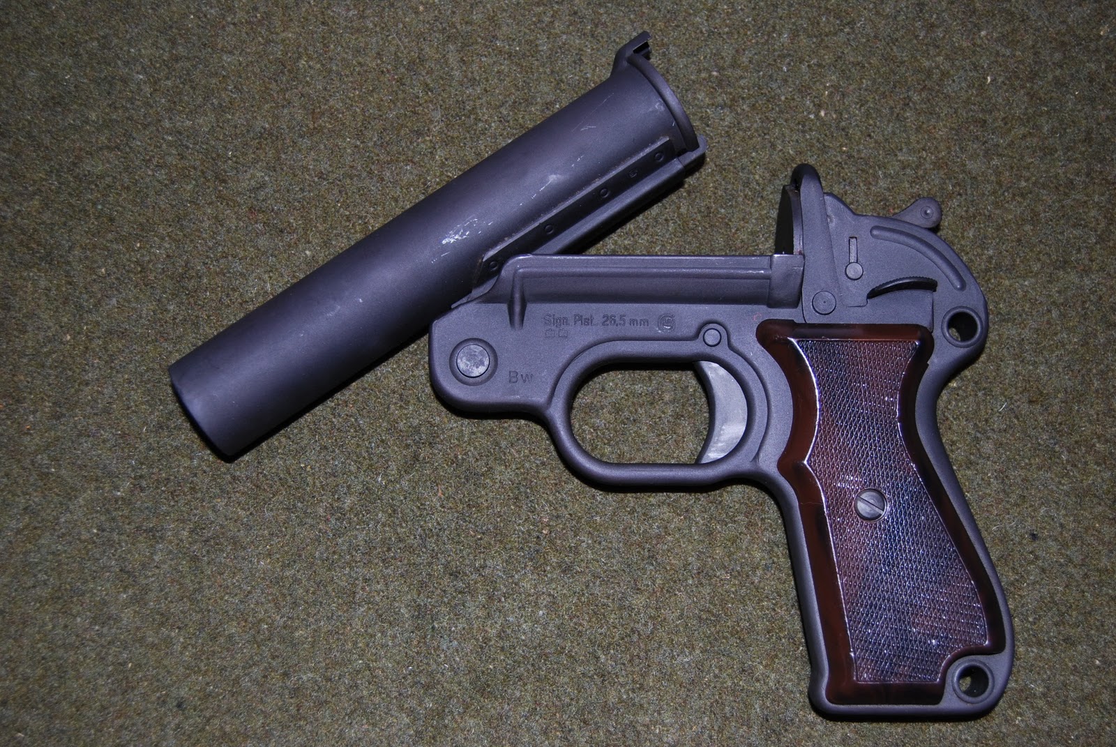 Both are military surplus 26.5mm flare pistols. 