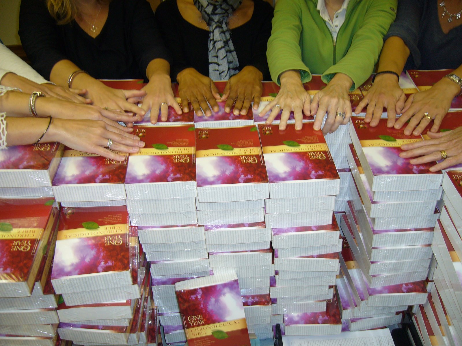 [hands+on+the+Bibles.JPG]