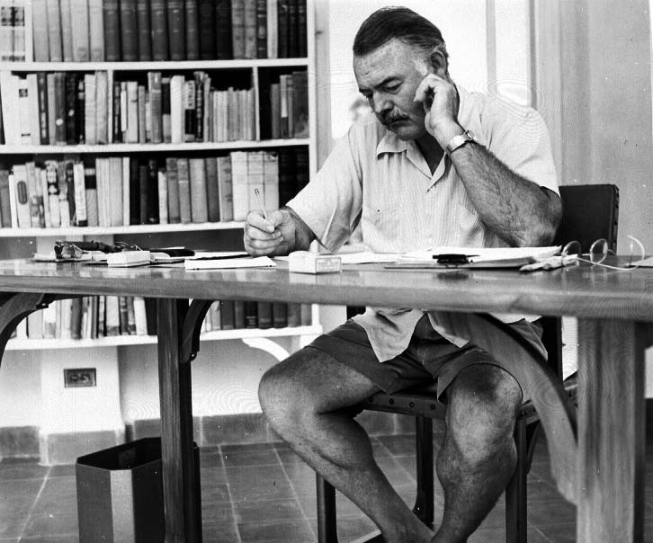 [Hemingway_at_his_writing_desk.[1].jpg]