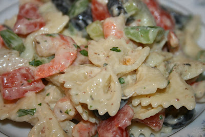 Bow tie pasta, onion, bell pepper, celery and black olives with seasoned boiled shrimp, dressed with a creamy mayonnaise and mustard vinegar dressing.