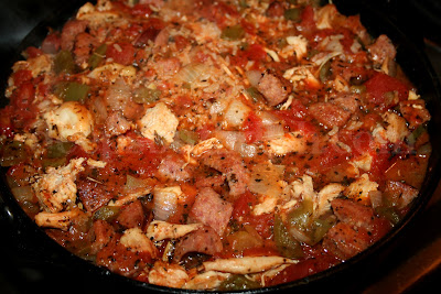 An oven baked Creole jambalaya containing chicken, shrimp and andouille smoked sausage.