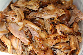 An easy crockpot BBQ pulled pork, cooked with onion, barbecue sauce, chicken broth, mustard, hot sauce and liquid smoke, perfect for shredding for sandwiches; shown here with Sweet Potato Fries.