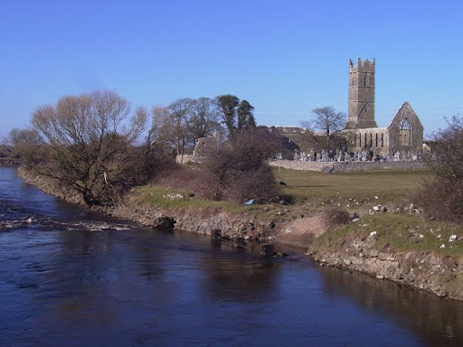 View of the River Clare and ruins of the Franciscan friary and graveyard, Claregalway, Co Galway, Ireland.