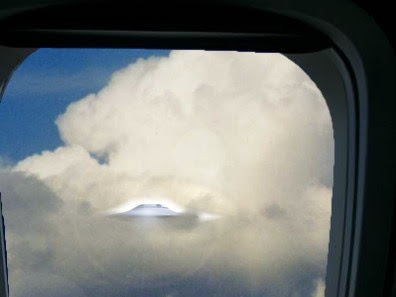 Flying Saucer in Clouds Seen Through Plane Window