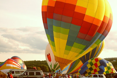 multi-colored hot air balloons warm up at Dansville Balloon Fest Sept 09